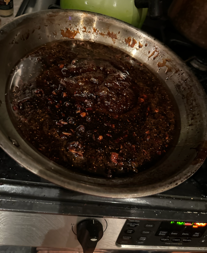 Wet ingredients bubbling in a pan.